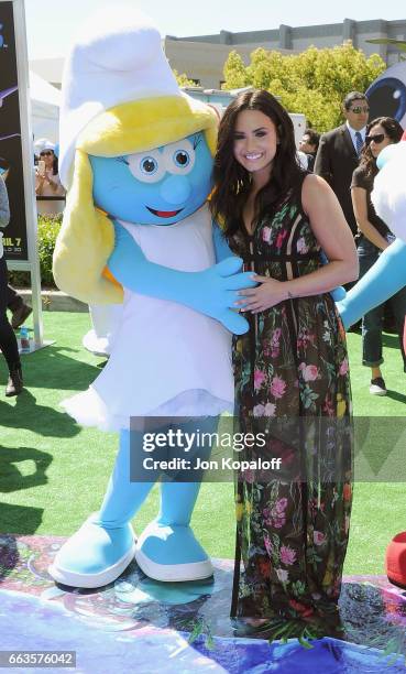 Demi Lovato posing with Smurf at the Los Angeles Premiere "Smurfs: The Lost Village" at ArcLight Cinemas on April 1, 2017 in Culver City, California.