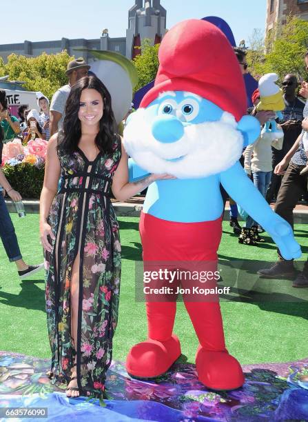 Demi Lovato posing with Smurf at the Los Angeles Premiere "Smurfs: The Lost Village" at ArcLight Cinemas on April 1, 2017 in Culver City, California.