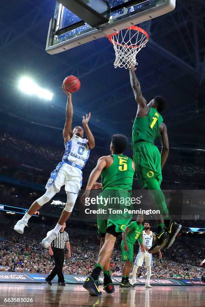 Nate Britt of the North Carolina Tar Heels shoots against Jordan Bell of the Oregon Ducks in the second half during the 2017 NCAA Men's Final Four...