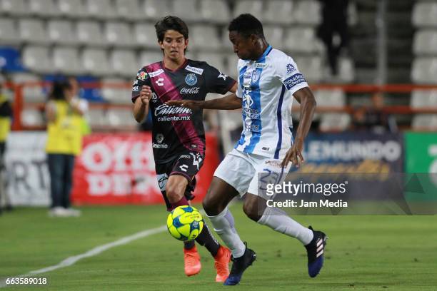Carlos Orrantia of Puebla fight for the ball with Oscar Murillo of Pachuca during a match between Pachuca and Puebla as part of Clausura Tournament...