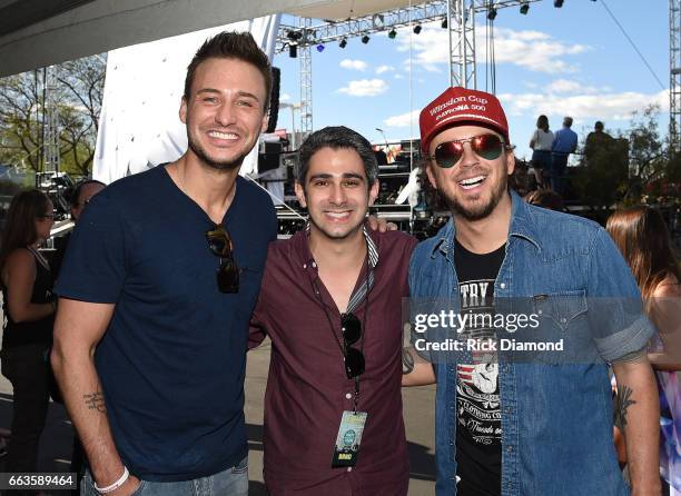 Musicians Eric Gunderson Love and Theft, reporter Adam Wurtzel and Stephen Barker Liles of Love and Theft at the ACM Party For A Cause: Tailgate...