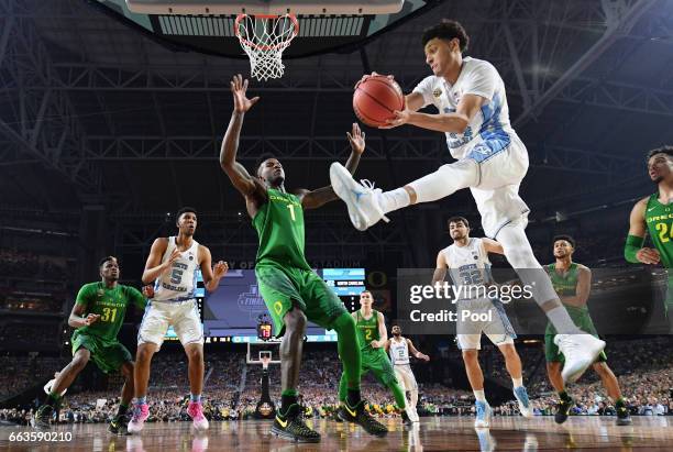 Justin Jackson of the North Carolina Tar Heels handles the ball against Jordan Bell of the Oregon Ducks in the second half during the 2017 NCAA Men's...