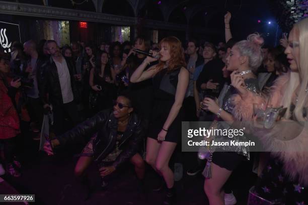 Caroline Hjelt of Icona Pop performs in the audience at the American Express Celebrates The New Platinum Card With Hamilton Takeover Experience on...