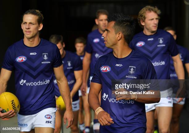 Nat Fyfe and Danyle Pearce of the Dockers walk out onto the ground to warm up prior to the round two AFL match between the Port Adelaide Power and...
