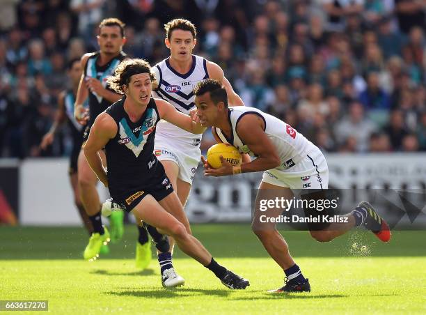 Danyle Pearce of the Dockers looks to pass the ball during the round two AFL match between the Port Adelaide Power and the Fremantle Dockers at...