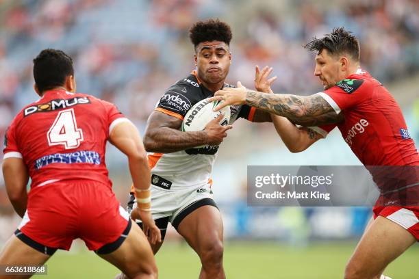 Kevin Naiqama of the Tigers takes on the defence during the round five NRL match between the Wests Tigers and the St George Illawarra Dragons at ANZ...