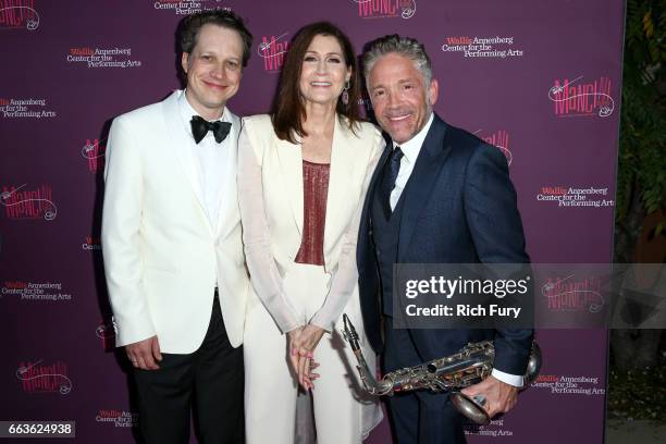 Composer Chris Walden, singer Monica Mancini and musician Dave Koz arrive at Mancini Delivered - A Musical Tribute To Ginny And Henry Manciniat the...
