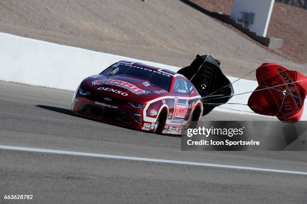 Greg Anderson Ken Black Racing Chevrolet Camaro NHRA Pro Stock deploys a parachute in the fourth round of qualifying for the18th Annual DENSO Spark...