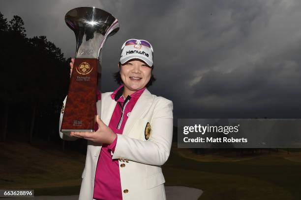 Min-Young Lee of Korea holds the winners trophy after the final round of the YAMAHA Ladies Open Katsuragi at the Katsuragi Golf Club Yamana Course on...
