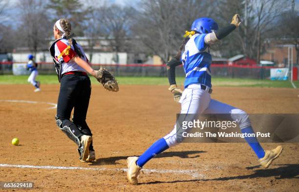 McLean catcher Gracen Govan, left, cannot control the throw to home as O'Connell's Leah Hammes scores the only run of theme in the top of the 8th...