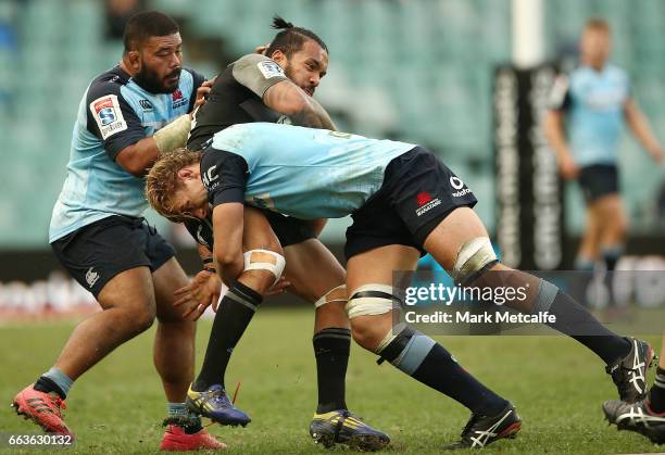 Digby Ioane of the Crusaders is tackled during the round six Super Rugby match between the Waratahs and the Crusaders at Allianz Stadium on April 2,...