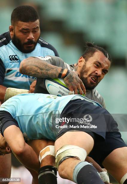 Digby Ioane of the Crusaders is tackled during the round six Super Rugby match between the Waratahs and the Crusaders at Allianz Stadium on April 2,...