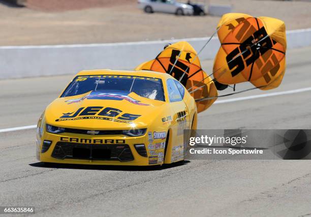 Jeg Coughlin Jr Jegs Chevrolet Camaro NHRA Pro Stock deploys a parachute during the NHRA DENSO Spark Plugs NHRA Nationals on April 01, 2017 at the...