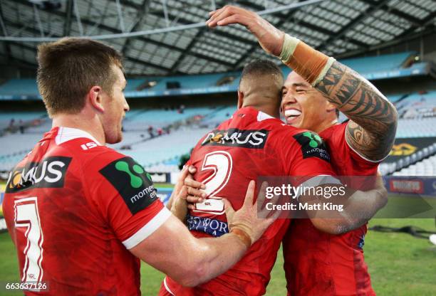 Nene Macdonald of the Dragons celebrates with team mates after scoring a try during the round five NRL match between the Wests Tigers and the St...