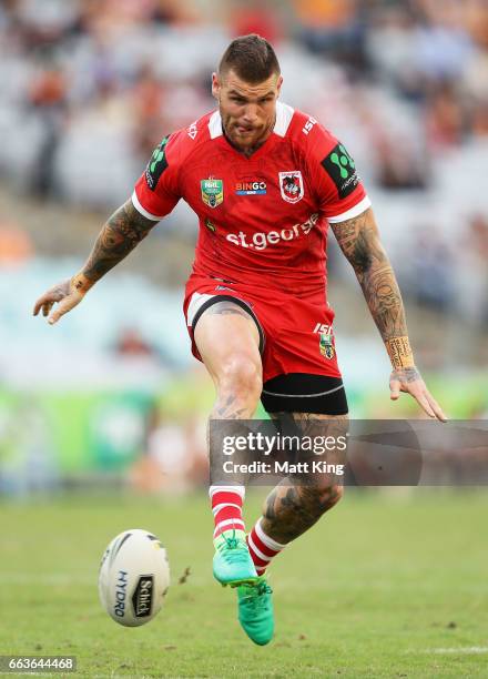 Josh Dugan of the Dragons kicks during the round five NRL match between the Wests Tigers and the St George Illawarra Dragons at ANZ Stadium on April...