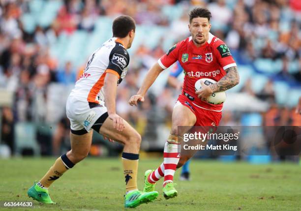 Gareth Widdop of the Dragons takes on the defence during the round five NRL match between the Wests Tigers and the St George Illawarra Dragons at ANZ...