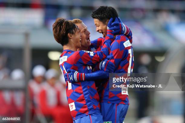 Akihiro Hyodo of Ventforet Kofu celebrates scoring the opening goal with his team mates Yuki Horigome and Oliver Bozanic during the J.League J1 match...
