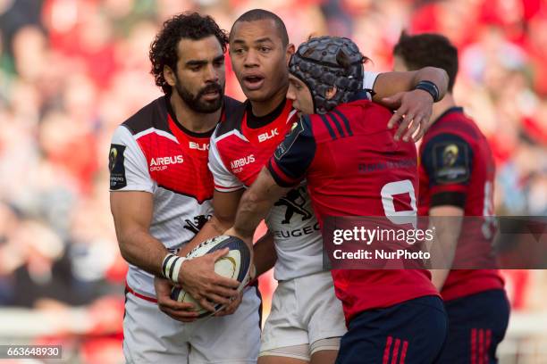 Yoann Huget and Gael Fickou of Toulouse and Duncan Williams of Mnster during the European Rugby Champions Cup Quarter-Final match between Munster...