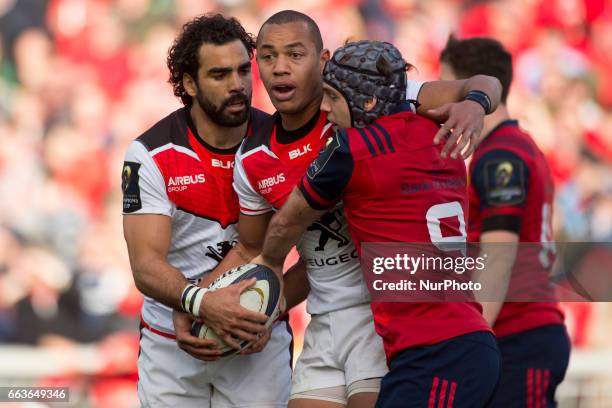 Yoann Huget and Gael Fickou of Toulouse and Duncan Williams of Mnster during the European Rugby Champions Cup Quarter-Final match between Munster...