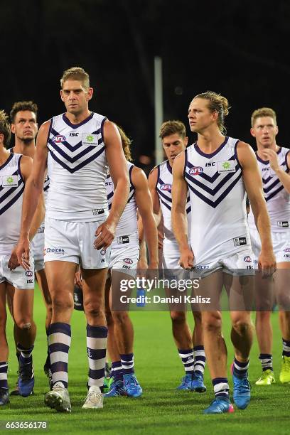 Aaron Sandilands and Nat Fyfe of the Dockers walk from the field after the round two AFL match between the Port Adelaide Power and the Fremantle...