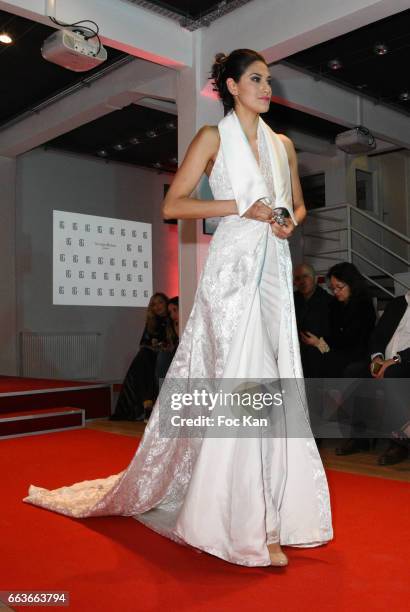 Model walks the runway during Georges Bedran Fashion Show at Espace Batignolles on April 1, 2017 in Paris, France.