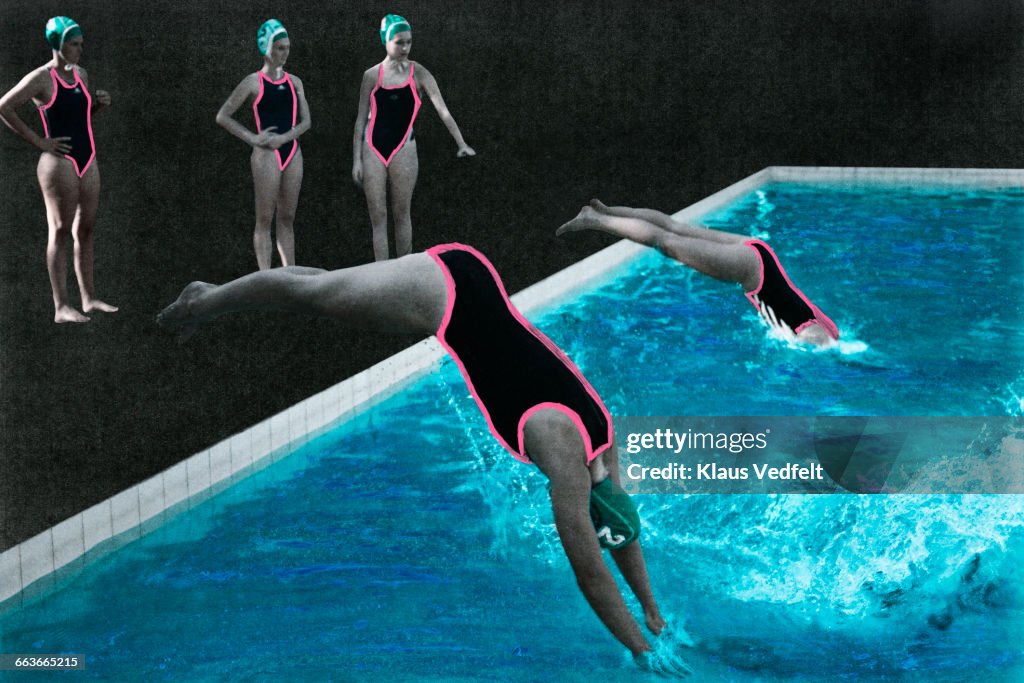 Womens waterpolo team diving into the pool
