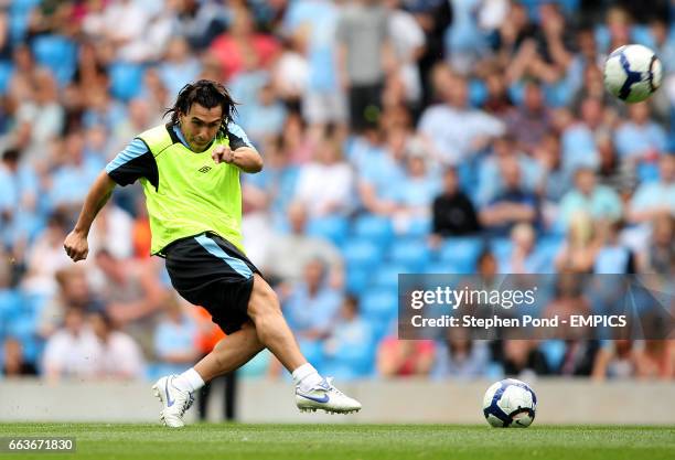 Manchester City's Carlos Tevez during the teams' pre season open training session at the City of Manchester Stadium