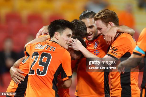 Jamie Maclaren of the Roar celebrates a goal with team mates during the round 25 A-League match between the Brisbane Roar and the Central Coast...
