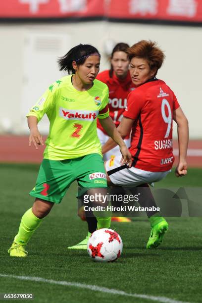 Saki Ueno of JEF United Chiba Ladies and Yuika Sugasawa of Urawa Red Diamonds Ladies compete for the ball during the Nadeshiko League match between...