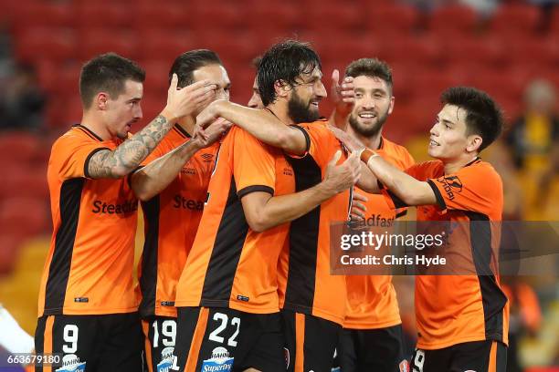 Thomas Broich of the Roar celebrates a goal with team mates during the round 25 A-League match between the Brisbane Roar and the Central Coast...