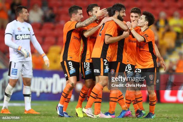 Thomas Broich of the Roar celebrates a goal with team mates during the round 25 A-League match between the Brisbane Roar and the Central Coast...