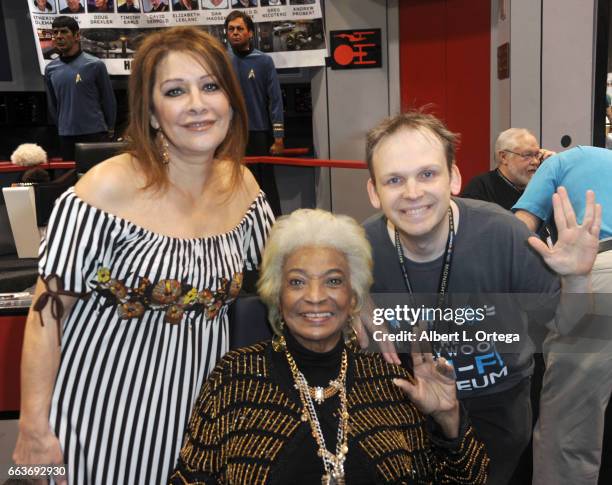 Actresses Marina Sirtis, Nichelle Nichols and CEO of the Sci-Fi Hollywood Museum Huston Huddleston of 'Star Trek' sign autographs at the Sci-Fi...