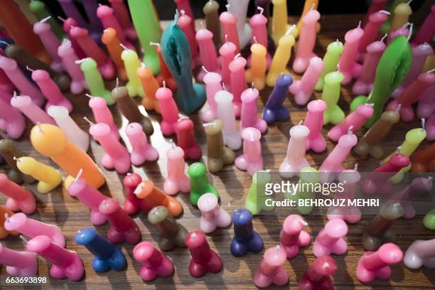 Candles in the shape of phalluses are displayed on a vendor's tray during the annual Kanamara Festival at Kanayama Shrine in Kawasaki on April 2,...
