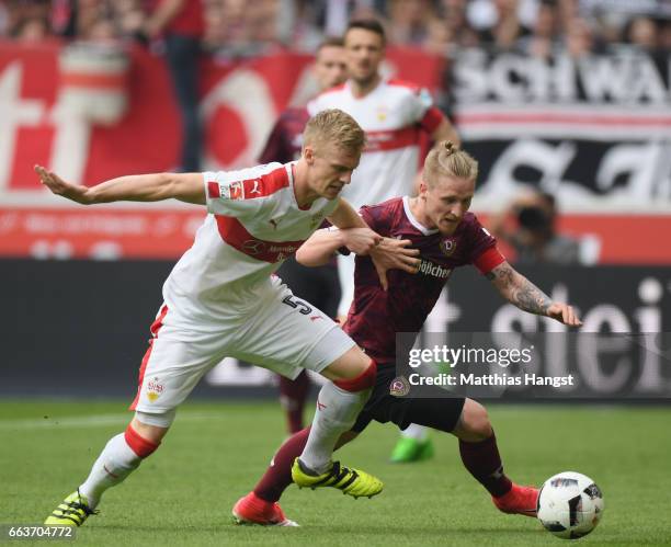 Timo Baumgartl of Stuttgart is challenged by Marvin Stefaniak of Dresden during the Second Bundesliga match between VfB Stuttgart v Dynamo Dresden at...