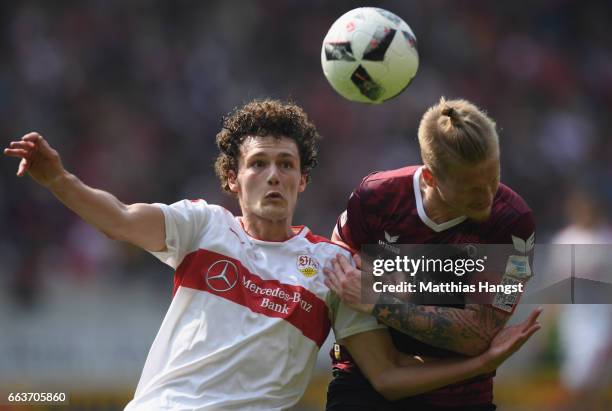 Benjamin Pavard of Stuttgart is challenged by Marvin Stefaniak of Dresden during the Second Bundesliga match between VfB Stuttgart v Dynamo Dresden...