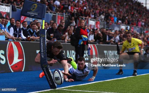 Stuart Hogg of Glasgow Warriors stops Chris Ashton of Saracens from scoring a try during the European Rugby Champions Cup match between Saracens and...