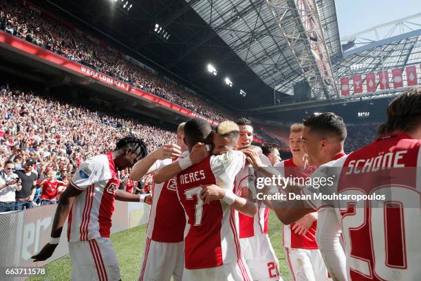 David Neres of Ajax celebrates scoring his teams second goal of the game with team mates during the Dutch Eredivisie match between Ajax Amsterdam and...
