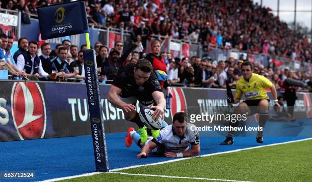 Stuart Hogg of Glasgow Warriors stops Chris Ashton of Saracens from scoring a try during the European Rugby Champions Cup match between Saracens and...