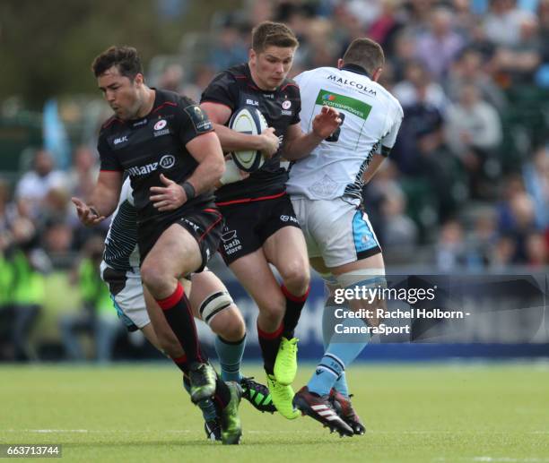 Saracens' Owen Farrell and Glasgow Warriors' Adam Ashe BARNET, ENGLAND during the European Rugby Champions Cup Quarter Final match between Saracens...