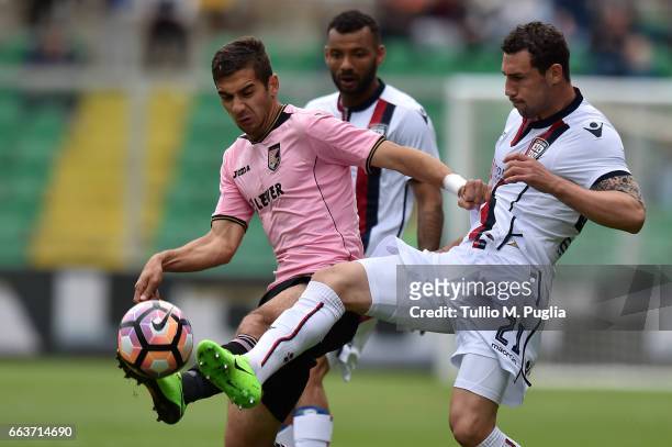 Ivaylo Chochev of Palermo and Artur Ionita of Cagliari compete for the ball during the Serie A match between US Citta di Palermo and Cagliari Calcio...