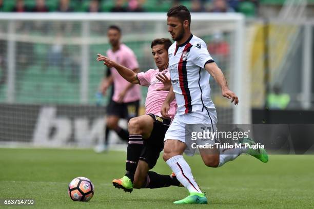 Ivaylo Chochev of Palermo and Panagiotis Tachtsidis of Cagliari compete for the ball during the Serie A match between US Citta di Palermo and...