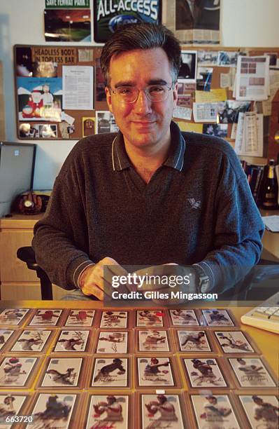 Fox Sports broadcaster Keith Olbermann poses with his autographed baseball card collection May 2, 2000 in Santa Monica, CA.