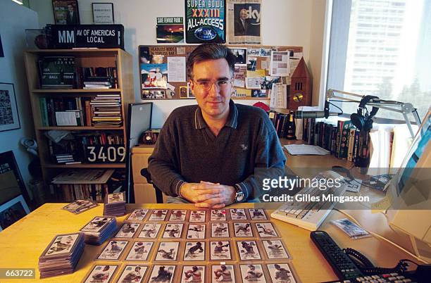Fox Sports broadcaster Keith Olbermann poses with his autographed baseball card collection May 2, 2000 in Santa Monica, CA.