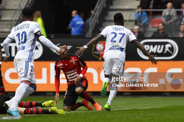Lyon's French forward Maxwel Cornet celebrates after scoring a goal during the French L1 football match between Rennes and Lyon on April 2 at the...