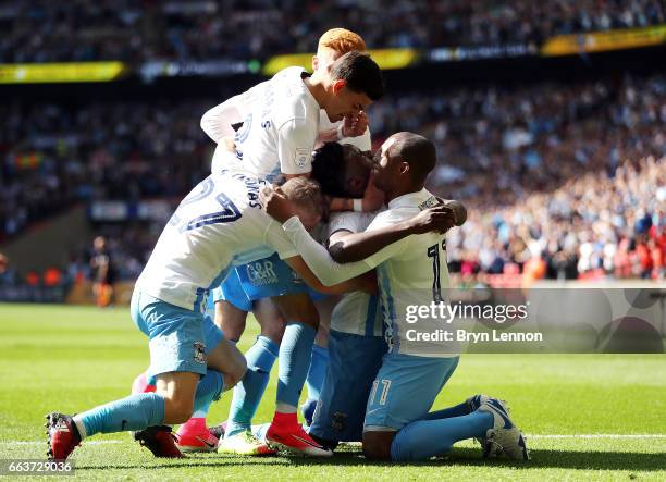Gael Bigirimana of Coventry City celebrates with team mates after scoring during the EFL Checkatrade Trophy Final between Coventry City v Oxford...