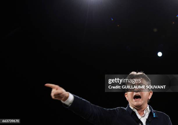 French presidential election candidate for the far-left coalition La France insoumise Jean-Luc Melenchon gestures as he speaks on on stage during a...