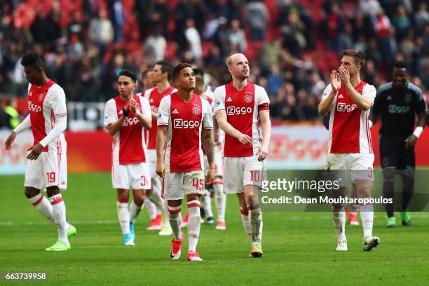 Justin Kluivert, Davy Klaassen and Joel Veltman of Ajax celebrate victory after the Dutch Eredivisie match between Ajax Amsterdam and Feyenoord at...
