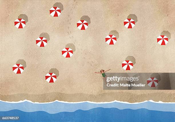 ilustraciones, imágenes clip art, dibujos animados e iconos de stock de high angle view of woman lying amidst sunshades at beach - beach holiday