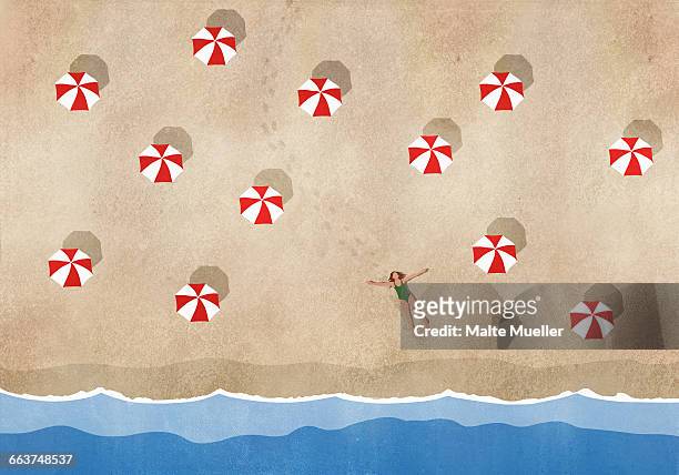 high angle view of woman lying amidst sunshades at beach - holiday stock illustrations