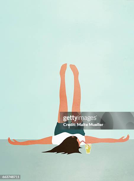 woman lying on floor with feet up while drinking cold drink - bearbeitungstechnik stock-grafiken, -clipart, -cartoons und -symbole